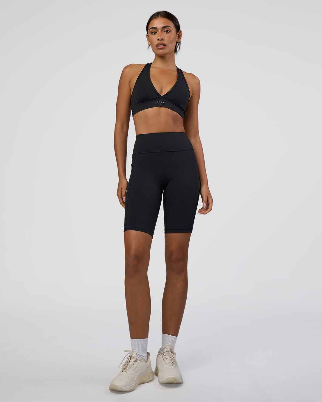Woman wearing Rep Ultra High-Rise 9" Short Pockets - Black-Black | Model:Ruby | Size:S - view 2