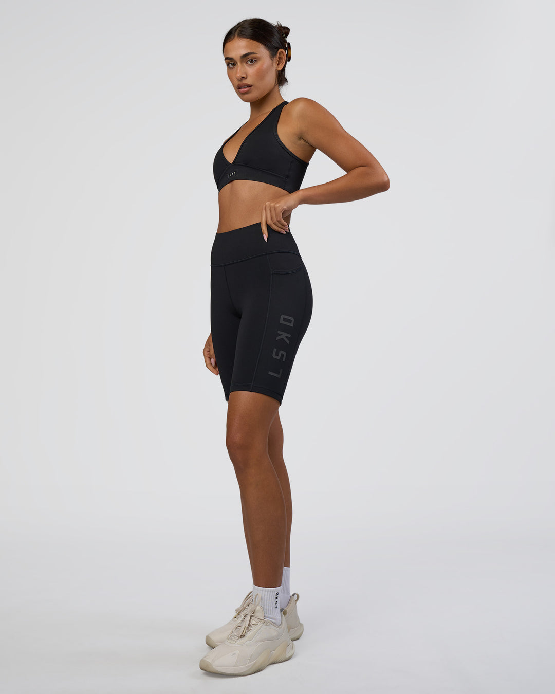 Woman wearing Rep Ultra High-Rise 9" Short Pockets - Black-Black | Model:Ruby | Size:S - view 5
