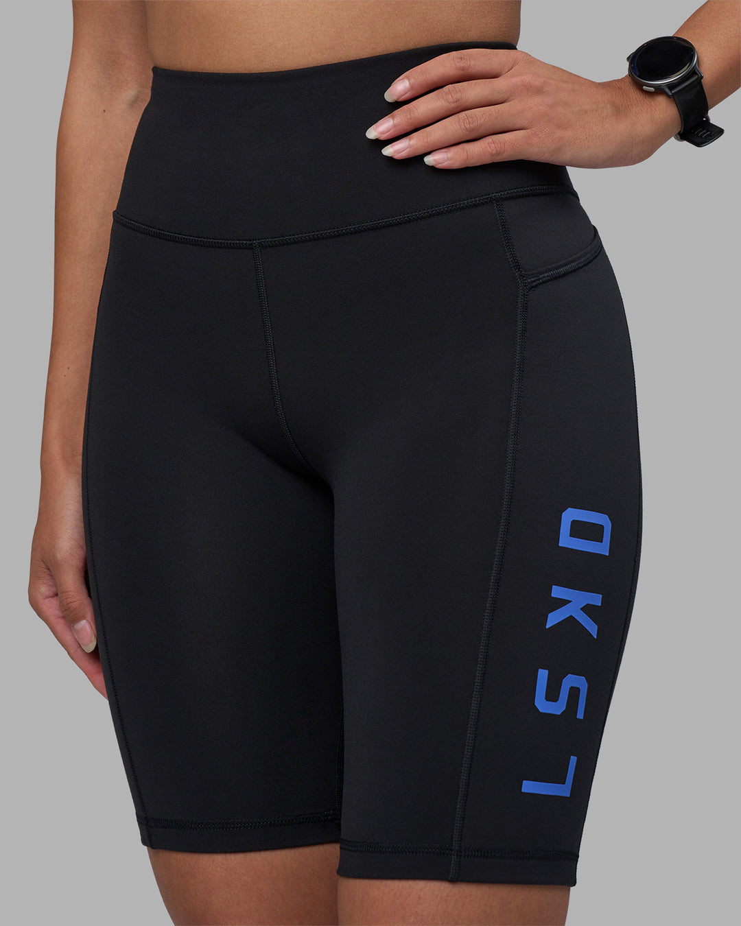 Woman wearing Rep Ultra High-Rise 9" Short Pockets - Black-Power Cobalt | Model:Rhiley | Size:S - view 6