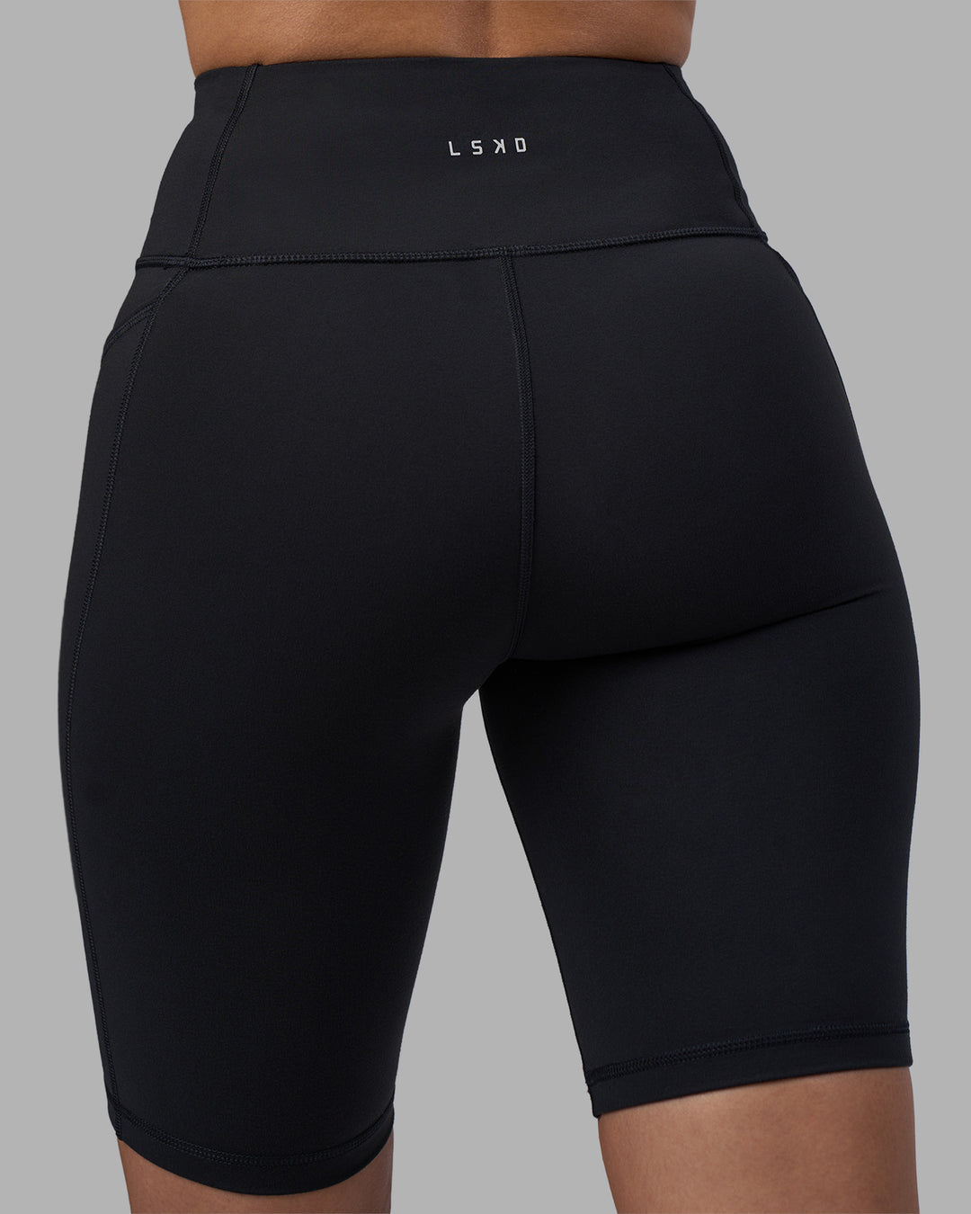 Woman wearing Rep Ultra High-Rise 9" Short Pockets - Black-Power Cobalt | Model:Rhiley | Size:S - view 8