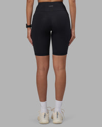 Woman wearing Rep Ultra High-Rise 9" Short Pockets - Black-Power Cobalt | Model:Rhiley | Size:S | Thumbnail Index: 3