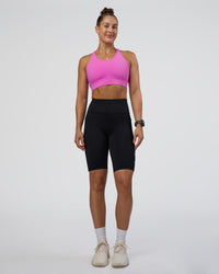 Woman wearing Rep Ultra High-Rise 9" Short Pockets - Black-Ultra Fuchsia | Model:Abbey | Size:S | Thumbnail Index: 4