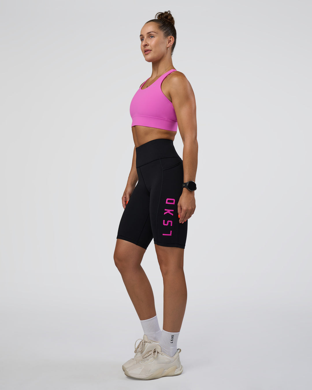 Woman wearing Rep Ultra High-Rise 9" Short Pockets - Black-Ultra Fuchsia | Model:Abbey | Size:S - view 1