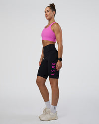 Woman wearing Rep Ultra High-Rise 9" Short Pockets - Black-Ultra Fuchsia | Model:Abbey | Size:S | Thumbnail Index: 0
