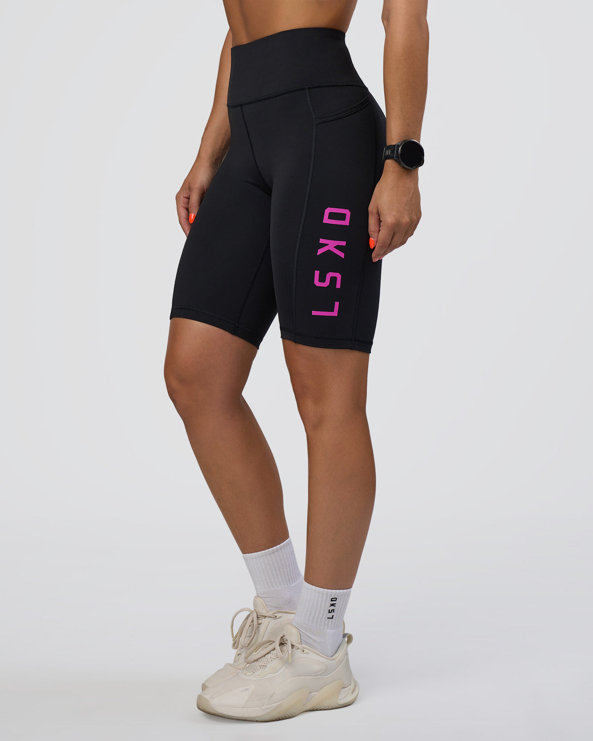 Woman wearing Rep Ultra High-Rise 9" Short Pockets - Black-Ultra Fuchsia | Model:Abbey | Size:S