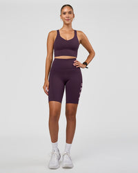 Woman wearing Rep Ultra High-Rise 9" Short Pockets - Midnight Plum-Marshmallow | Model:Rhiley | Size:S | Thumbnail Index: 3