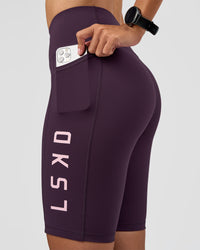 Woman wearing Rep Ultra High-Rise 9" Short Pockets - Midnight Plum-Marshmallow | Model:Rhiley | Size:S | Thumbnail Index: 5