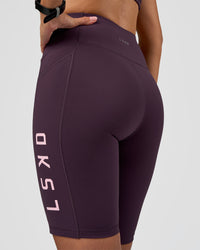 Woman wearing Rep Ultra High-Rise 9" Short Pockets - Midnight Plum-Marshmallow | Model:Rhiley | Size:S | Thumbnail Index: 4