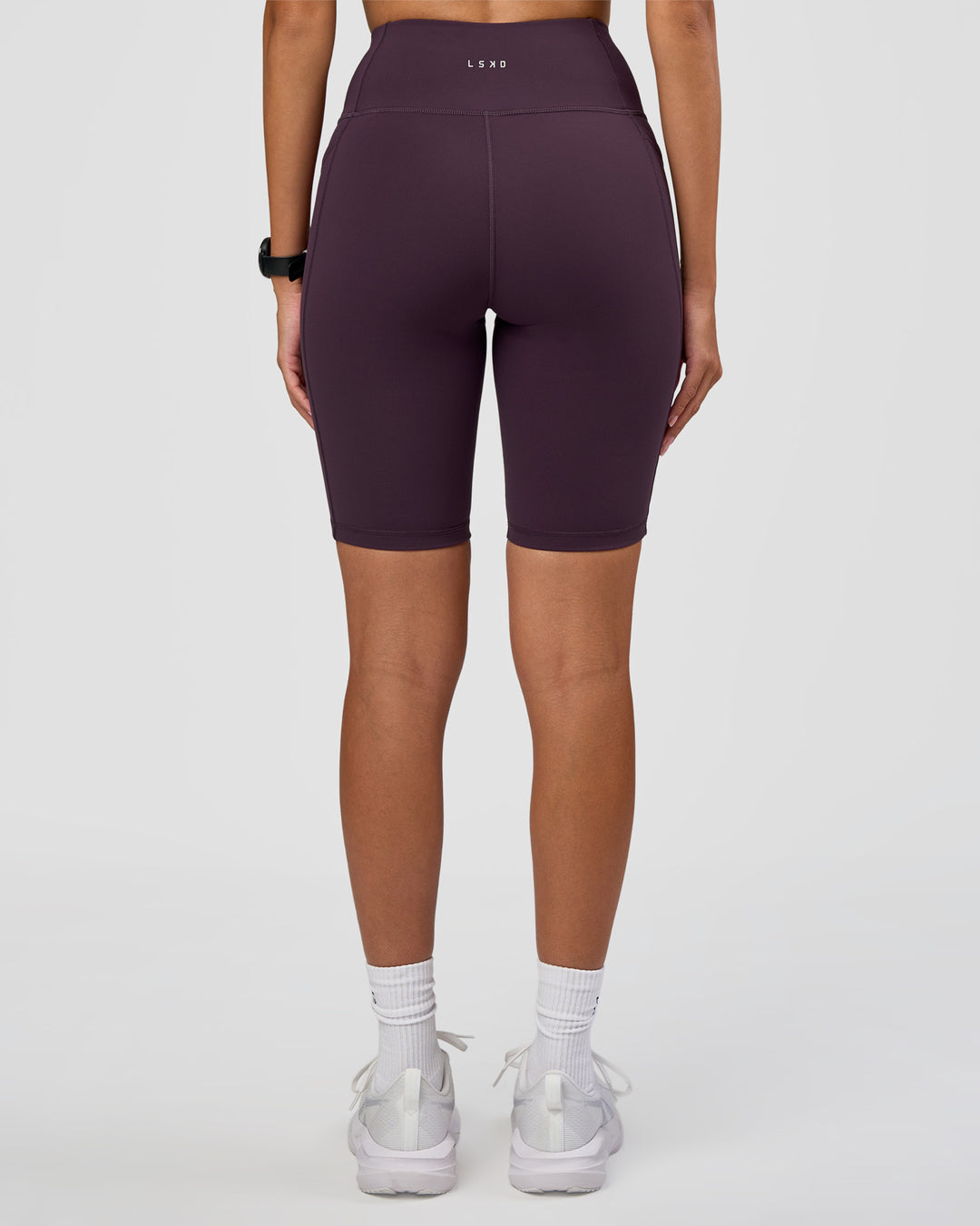 Woman wearing Rep Ultra High-Rise 9" Short Pockets - Midnight Plum-Marshmallow | Model:Rhiley | Size:S - view 8