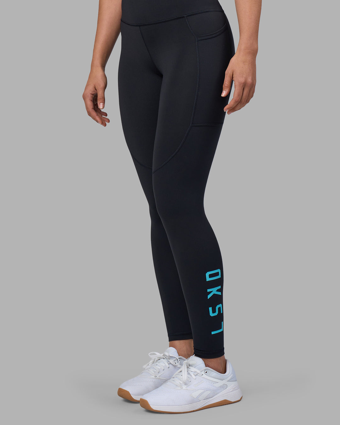 Woman wearing Rep Ultra High-Rise Full Length Legging Pockets - Black-Blue Atoll | Model:Sophie | Size:S - view 1