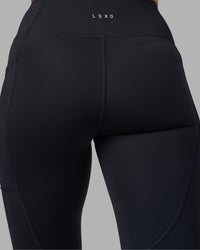 Woman wearing Rep Ultra High-Rise Full Length Legging Pockets - Black-Blue Atoll | Model:Sophie | Size:S | Thumbnail Index: 8