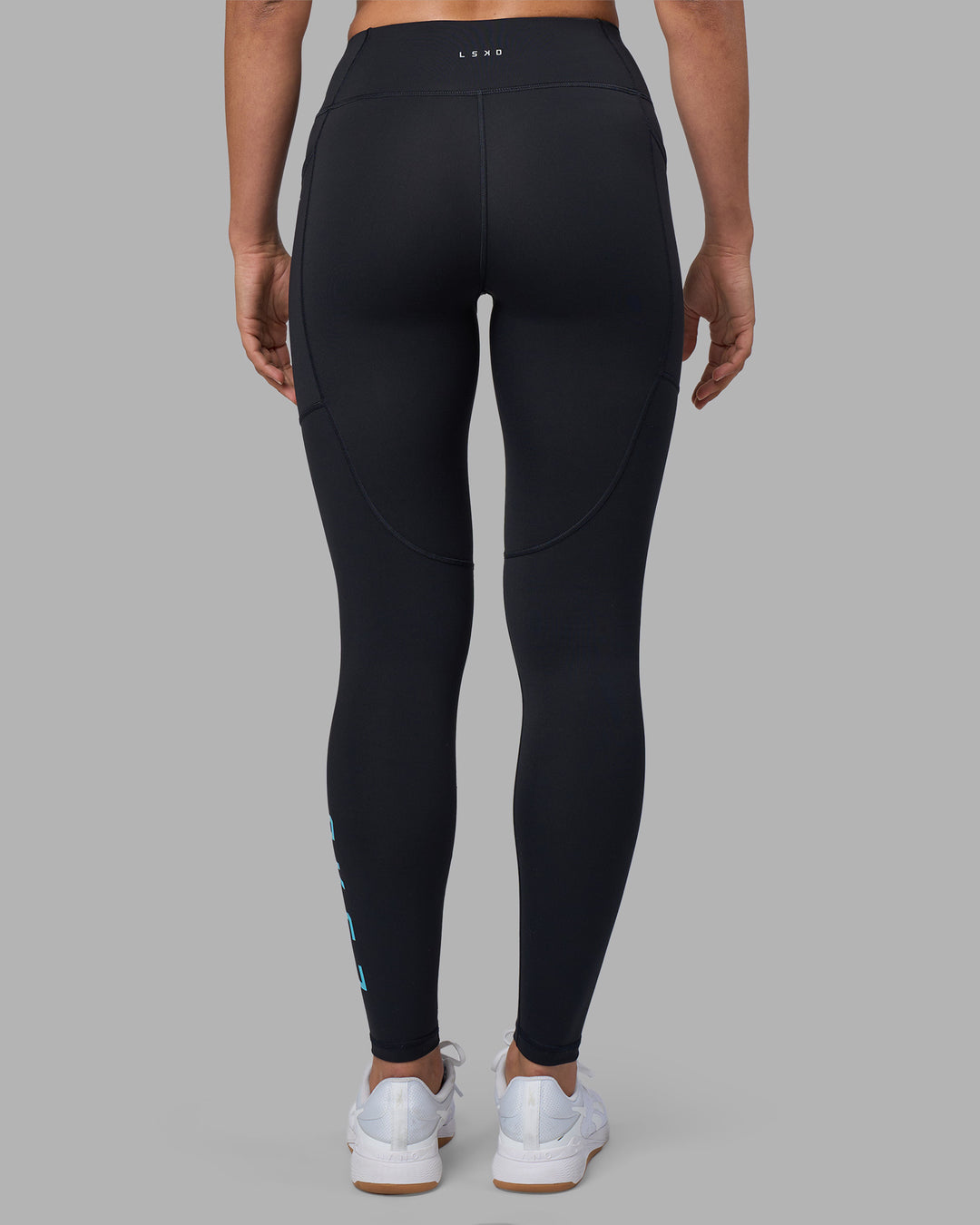 Woman wearing Rep Ultra High-Rise Full Length Legging Pockets - Black-Blue Atoll | Model:Sophie | Size:S - view 4