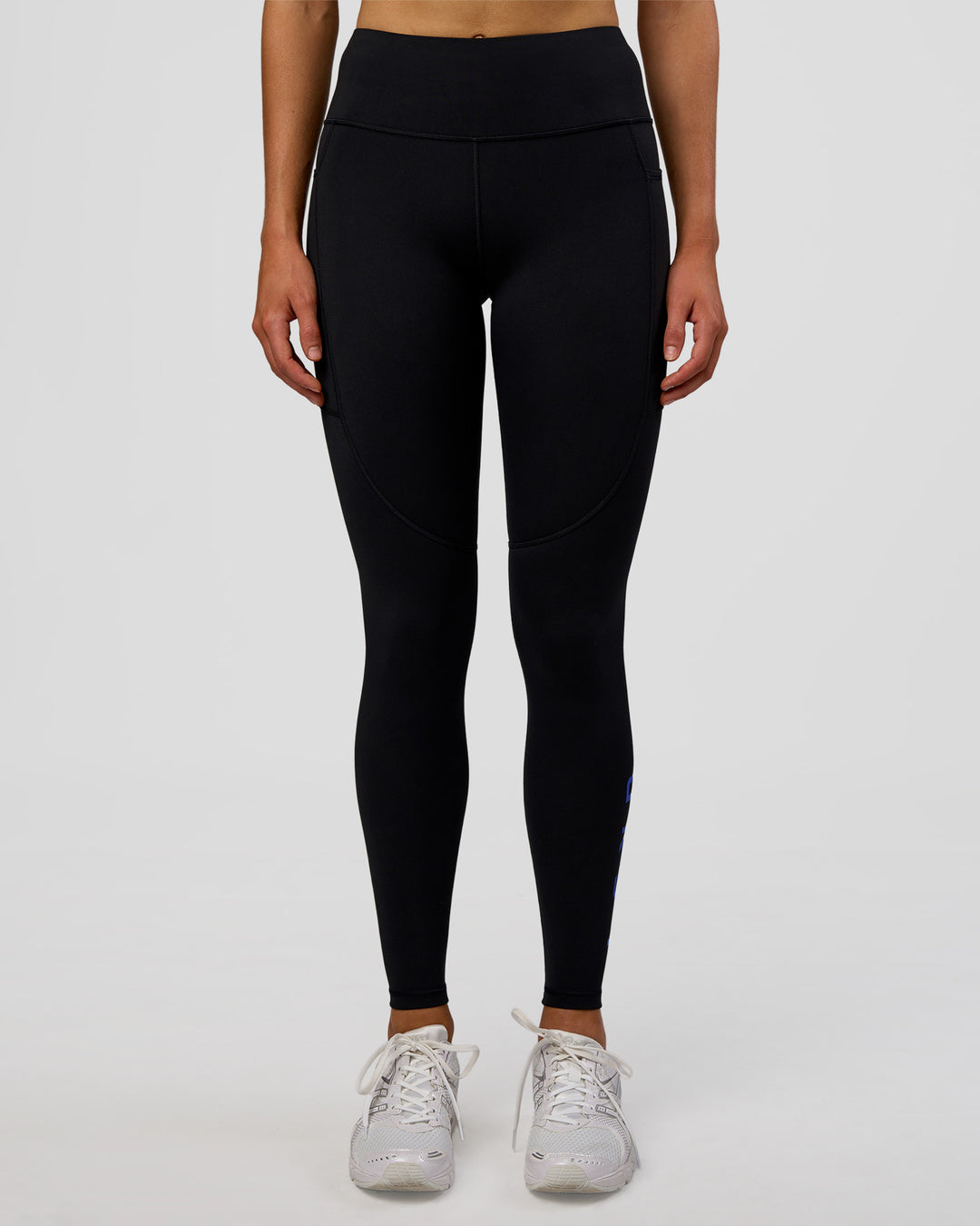Woman wearing Rep Ultra High-Rise Full Length Legging Pockets - Black-Electric Indigo | Model:Evie | Size:S - view 8