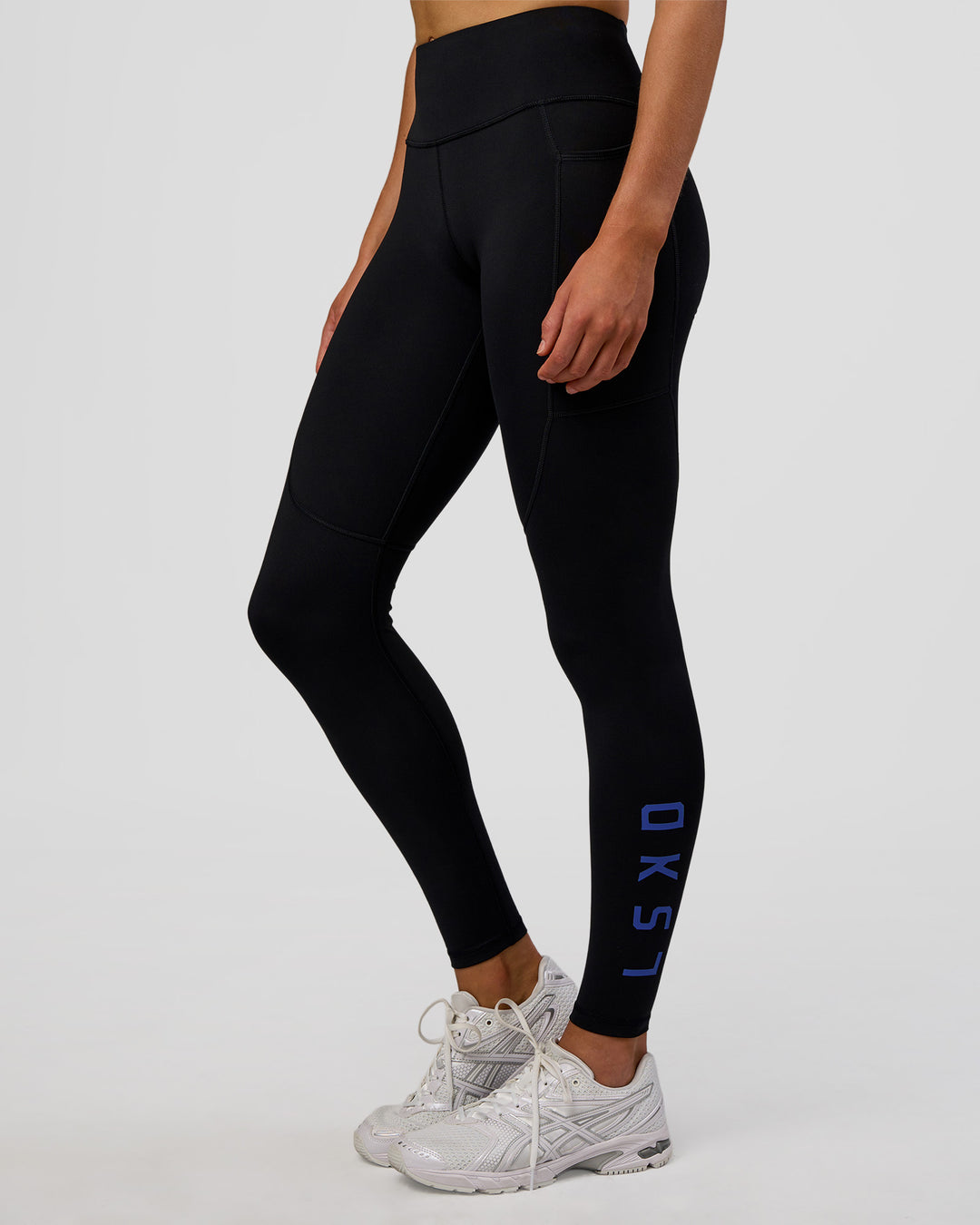 Woman wearing Rep Ultra High-Rise Full Length Legging Pockets - Black-Electric Indigo | Model:Evie | Size:S - view 6
