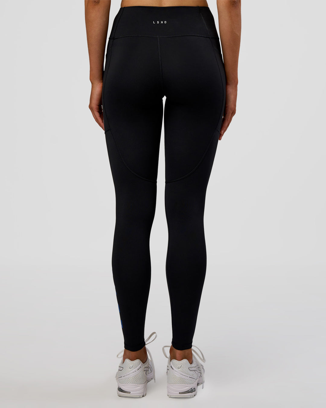 Woman wearing Rep Ultra High-Rise Full Length Legging Pockets - Black-Electric Indigo | Model:Evie | Size:S - view 3