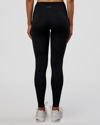 Woman wearing Rep Ultra High-Rise Full Length Legging Pockets - Black-Electric Indigo | Model:Evie | Size:S | Thumbnail Index: 2