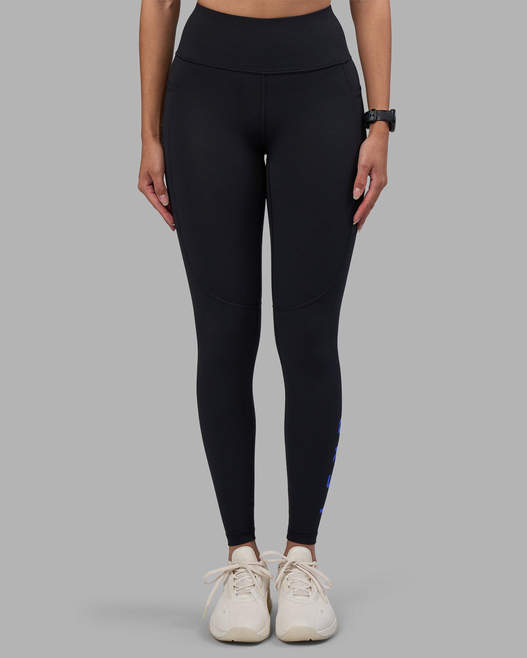 Woman wearing Rep Ultra High-Rise Full Length Legging Pockets - Black-Power Cobalt | Model:Rhiley | Size:S - view 3