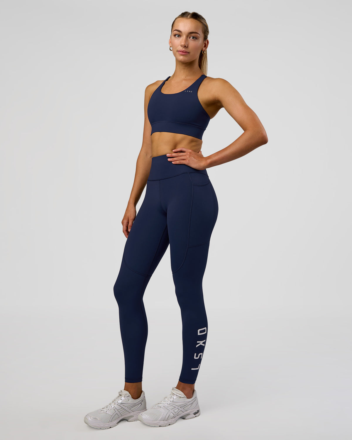 Woman wearing Rep Ultra High-Rise Full Length Legging Pockets - Future Navy-White | Model:Evie | Size:S