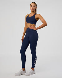 Woman wearing Rep Ultra High-Rise Full Length Legging Pockets - Future Navy-White | Model:Evie | Size:S | Thumbnail Index: 1