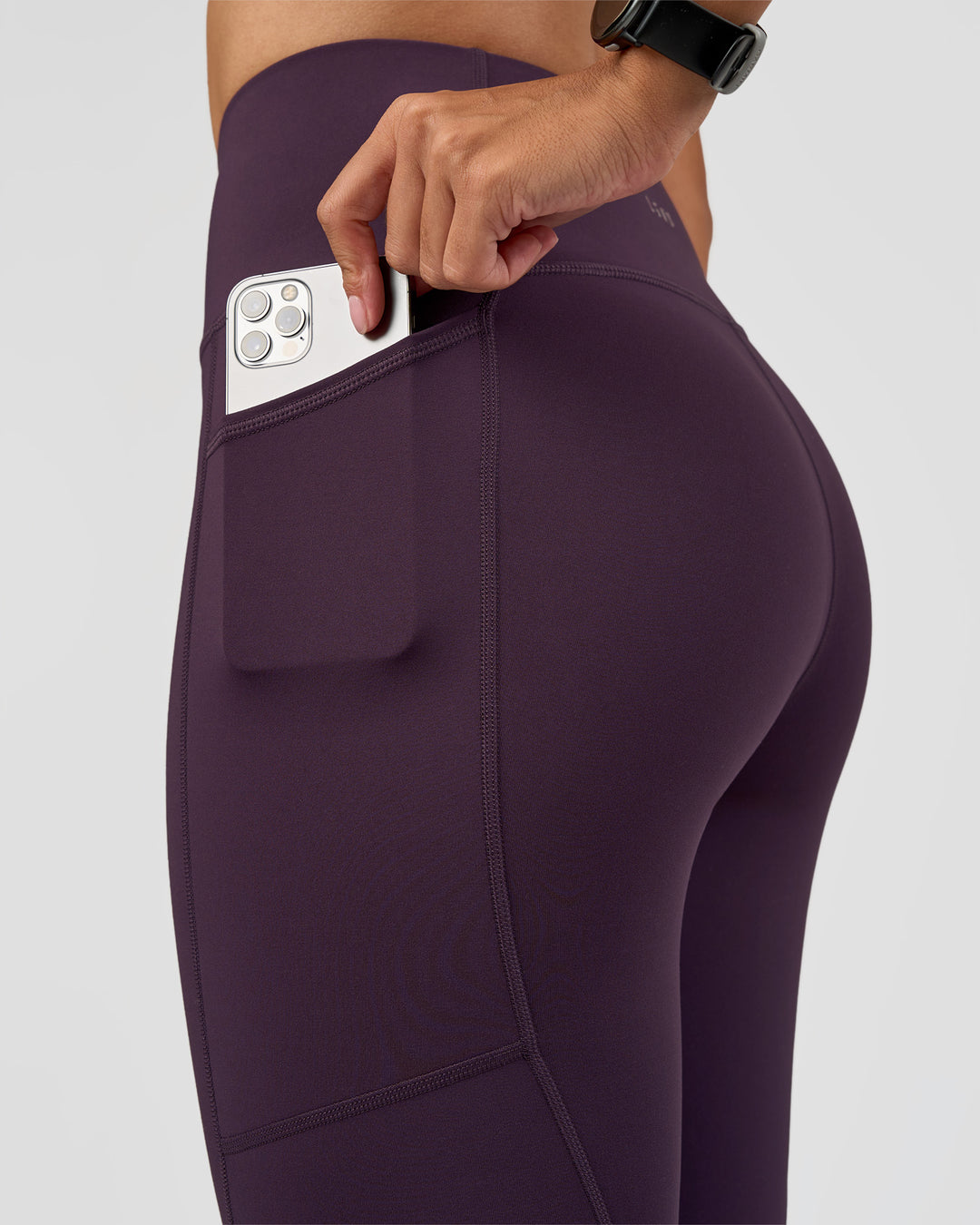 Woman wearing Rep Ultra High-Rise Full Length Legging Pockets - Midnight Plum-Marshmallow | Model:Rhiley | Size:S - view 3