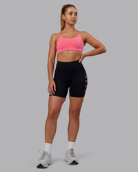 Woman wearing Rep Ultra High-Rise 6" Short Pockets - Black-Pink Lemonade | Model:Hannah | Size:S | Thumbnail Index: 1