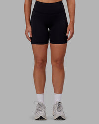 Woman wearing Rep Ultra High-Rise 6" Short Pockets - Black-Pink Lemonade | Model:Hannah | Size:S | Thumbnail Index: 6