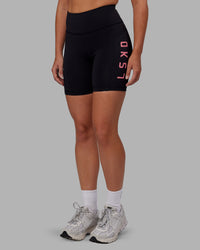 Woman wearing Rep Ultra High-Rise 6" Short Pockets - Black-Pink Lemonade | Model:Hannah | Size:S | Thumbnail Index: 2