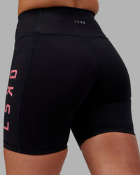 Woman wearing Rep Ultra High-Rise 6" Short Pockets - Black-Pink Lemonade | Model:Hannah | Size:S | Thumbnail Index: 7