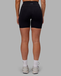 Woman wearing Rep Ultra High-Rise 6" Short Pockets - Black-Pink Lemonade | Model:Hannah | Size:S | Thumbnail Index: 3