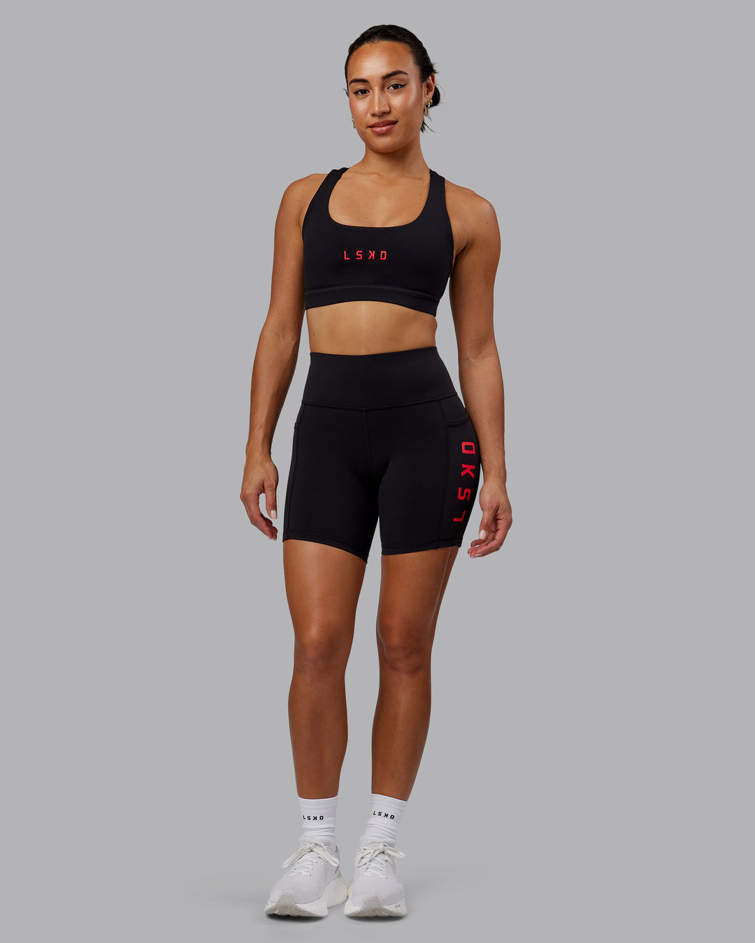 Woman wearing Rep Ultra High-Rise 6" Short Pockets - Black-Scarlet | Model:Demi | Size:S - view 2