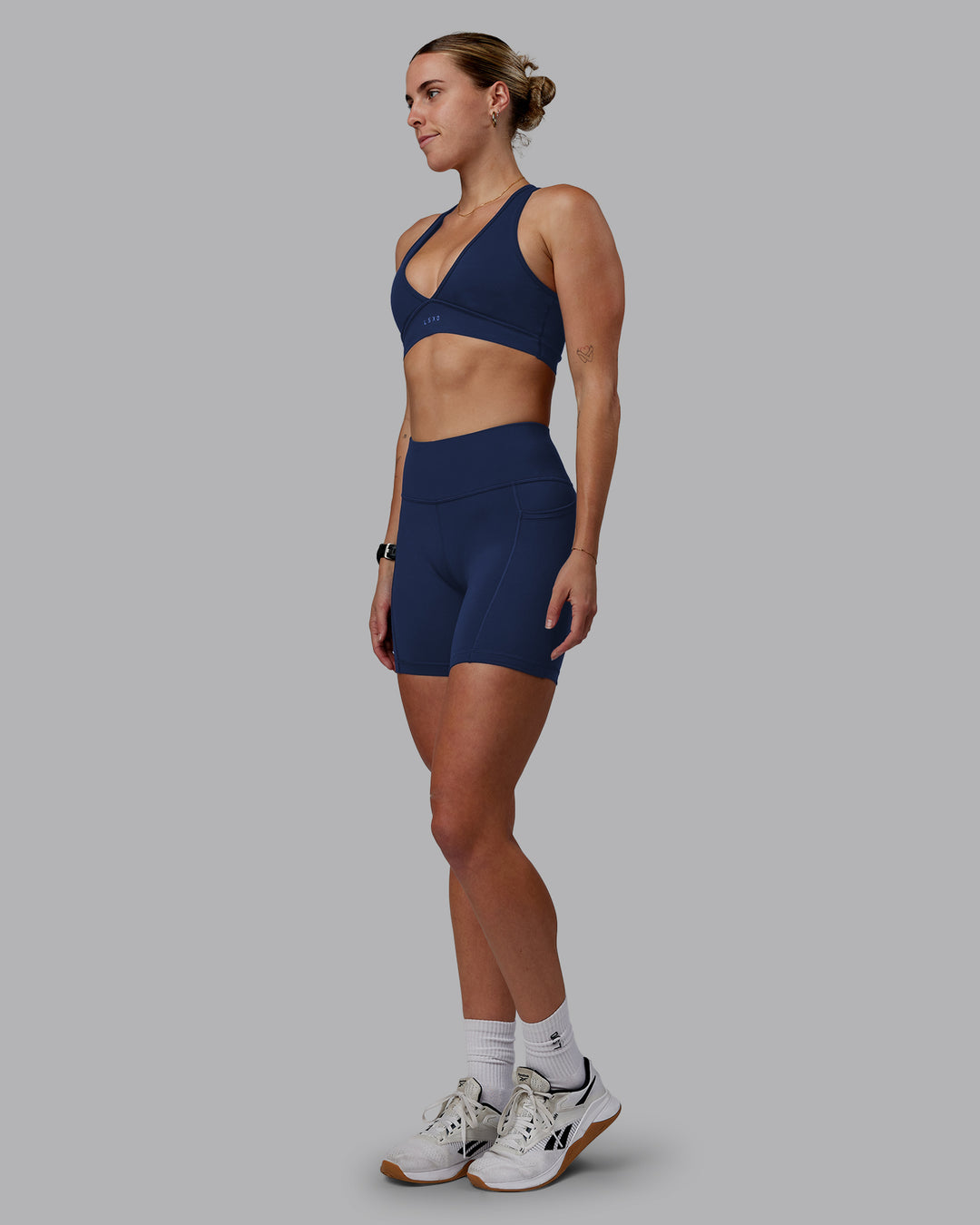 Woman wearing Rep Ultra High-Rise 6" Short Pockets No Logo - Future Navy | Model:Shae | Size:S - view 2