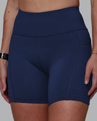 Woman wearing Rep Ultra High-Rise 6" Short Pockets No Logo - Future Navy | Model:Shae | Size:S | Thumbnail Index: 0