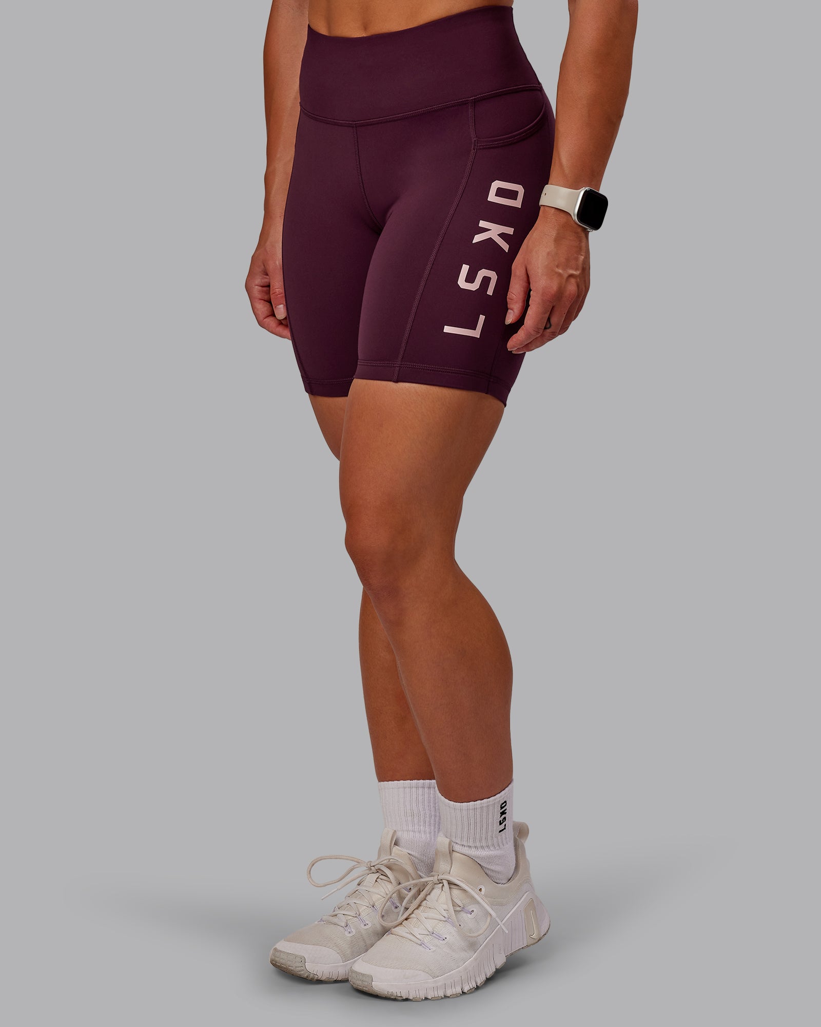 Woman wearing Rep Ultra High-Rise 6" Short Pockets - Cherry Lacquer-Marshmallow | Model:Amber | Size:S