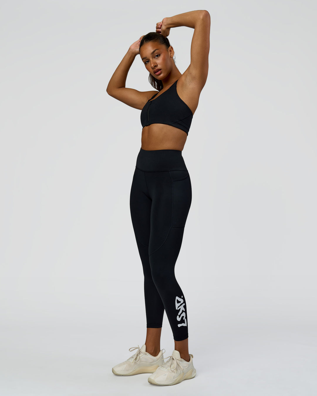 Woman wearing Rep Street Script Ultra High-Rise 7/8 Legging Pockets - Black-White | Model:Rosie | Size:S - view 1