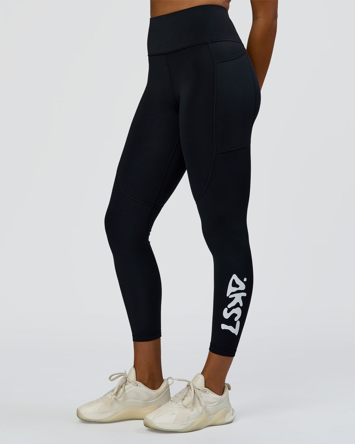 Woman wearing Rep Street Script Ultra High-Rise 7/8 Legging Pockets - Black-White | Model:Rosie | Size:S