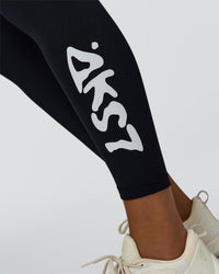 Woman wearing Rep Street Script Ultra High-Rise Full Length Legging Pockets - Black-White | Model:Rosie | Size:S | Thumbnail Index: 1