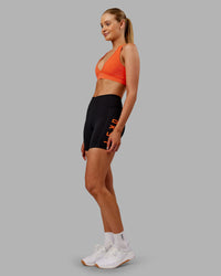 Woman wearing Rep Ultra High-Rise 6" Short Pockets - Black-Ultra Orange | Model:Ella | Size:S | Thumbnail Index: 4