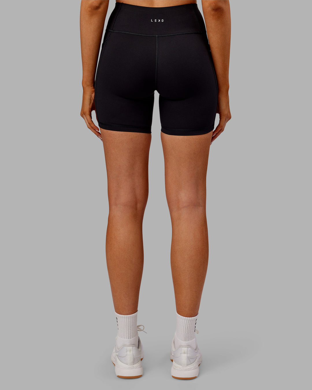Woman wearing Rep Ultra High-Rise 6" Short Pockets - Black-Ultra Orange | Model:Ella | Size:S - view 4