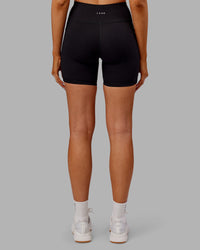 Woman wearing Rep Ultra High-Rise 6" Short Pockets - Black-Ultra Orange | Model:Ella | Size:S | Thumbnail Index: 3