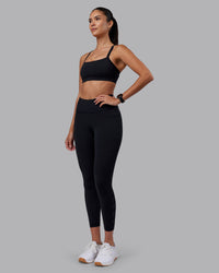 Woman wearing Rep Ultra High-Rise 7/8 Legging Pockets - Black-Black | Model:Rhiley | Size:S | Thumbnail Index: 0