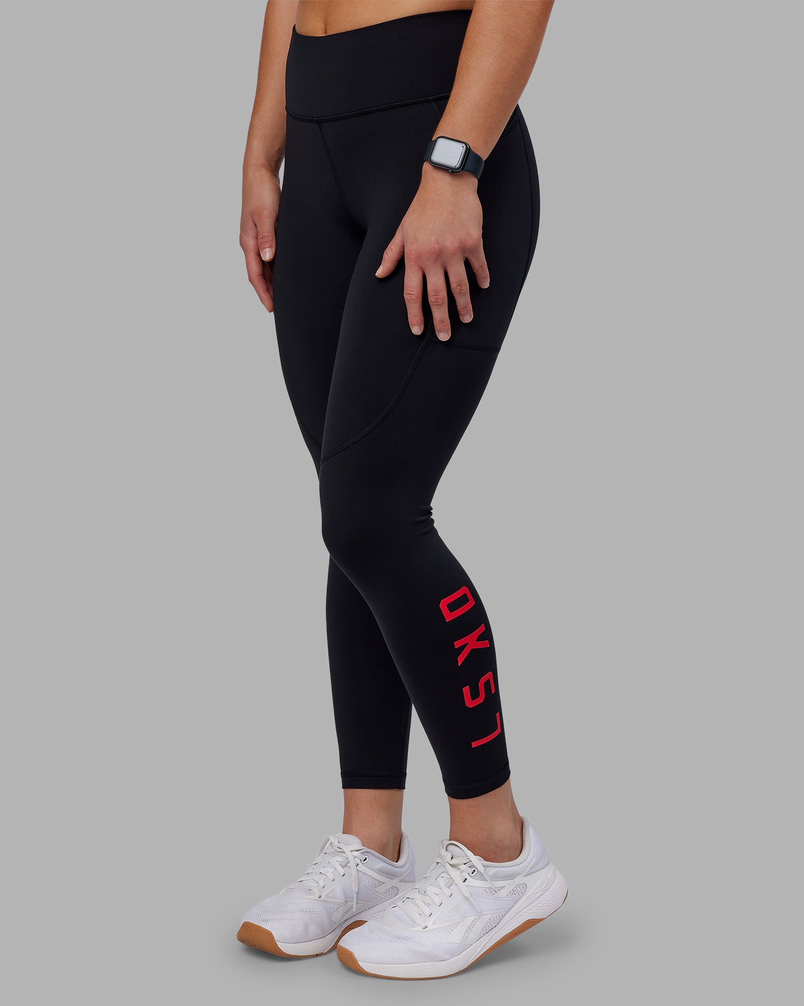 Woman wearing Rep Ultra High-Rise 7/8 Legging Pockets - Black-Scarlet | Model:Keisha | Size:S
