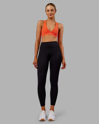 Woman wearing Rep Ultra High-Rise 7/8 Legging Pockets - Black-Ultra Orange | Model:Ella | Size:S | Thumbnail Index: 0