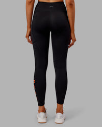 Woman wearing Rep Ultra High-Rise 7/8 Legging Pockets - Black-Ultra Orange | Model:Ella | Size:S | Thumbnail Index: 3