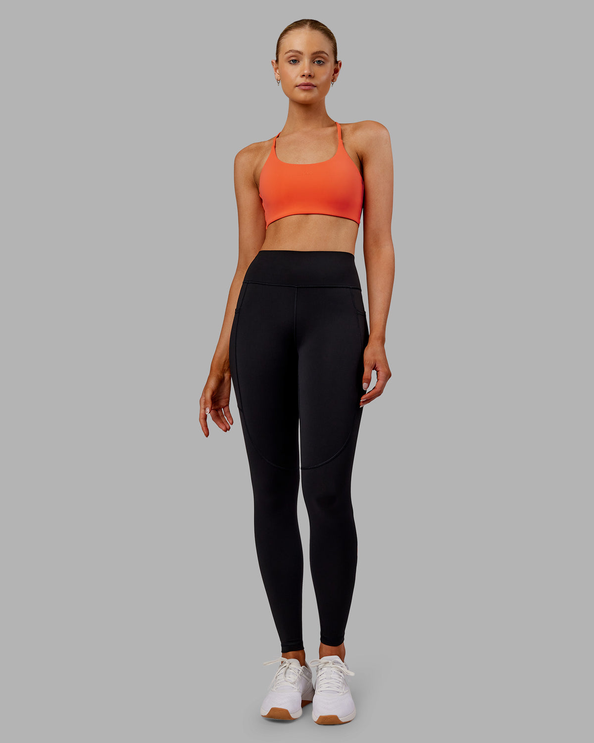 Woman wearing Rep Ultra High-Rise Full Length Legging Pockets - Black-Ultra Orange | Model:Ella | Size:S