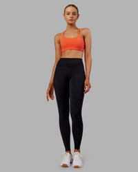 Woman wearing Rep Ultra High-Rise Full Length Legging Pockets - Black-Ultra Orange | Model:Ella | Size:S | Thumbnail Index: 1