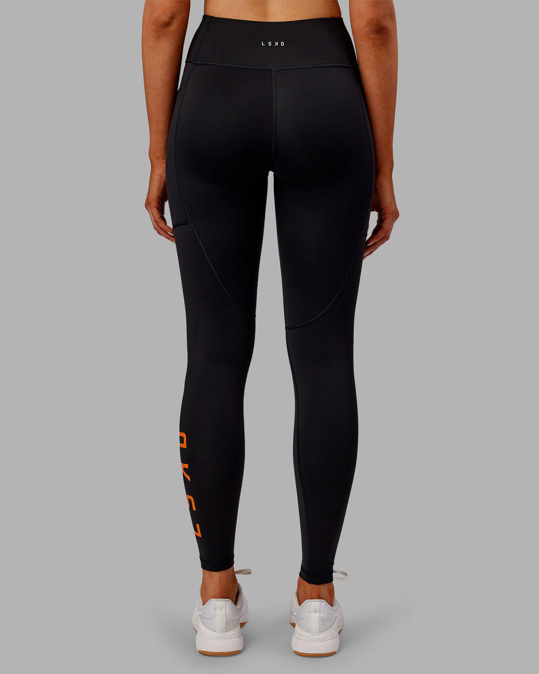 Woman wearing Rep Ultra High-Rise Full Length Legging Pockets - Black-Ultra Orange | Model:Ella | Size:S - view 4