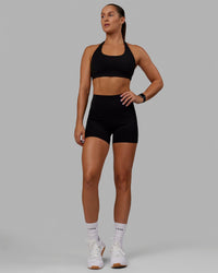 Woman wearing O.G. Rep Ultra High-Rise 4" Short Pockets - Black-Black | Model:Abbey| Size:S | Thumbnail Index: 7