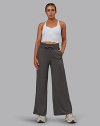 Woman wearing Restore CloudFLX Wide Leg Pant - Dark Storm | Model:Paris | Size:S | Thumbnail Index: 1