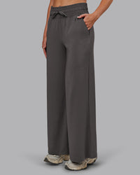 Woman wearing Restore CloudFLX Wide Leg Pant - Dark Storm | Model:Paris | Size:S | Thumbnail Index: 0