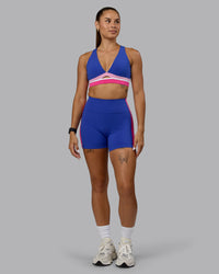 Woman wearing Revitalise Sports Bra - Power Cobalt-Fuchsia Pink | Thumbnail Index: 4